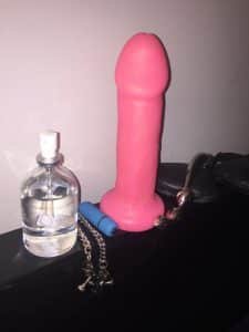 Dildo on Headboard with Lube, Vibrator, Nipple Clamps, Blindfold, and NJoy metal wand