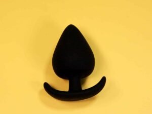 Silicone black spade butt plug with comfort wearable base