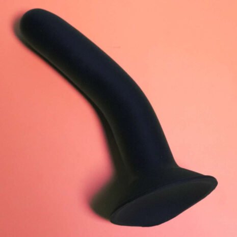 Back Ainsley silicone toy black Ainsley toy with suction cup base silicone on orange background